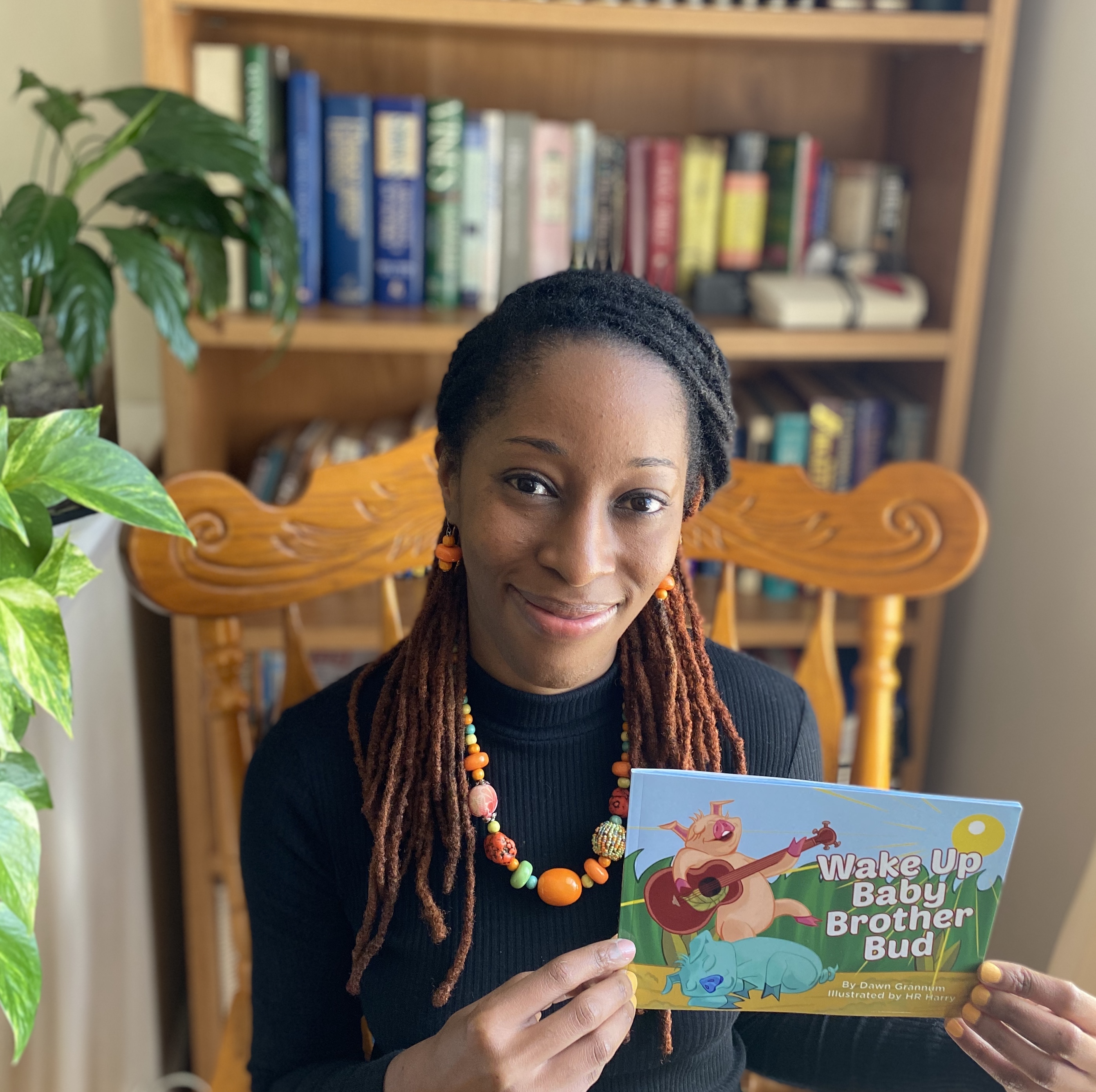 Dawn holding Baby Brother Bud Book